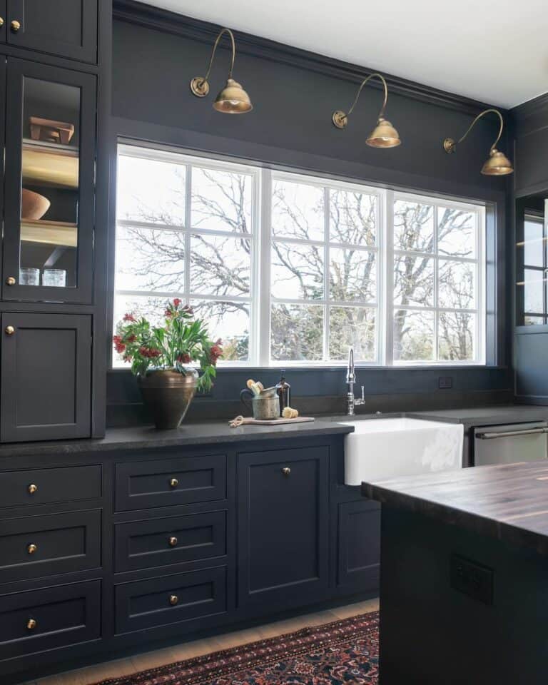 Black Kitchen with No Backsplash on Window Wall