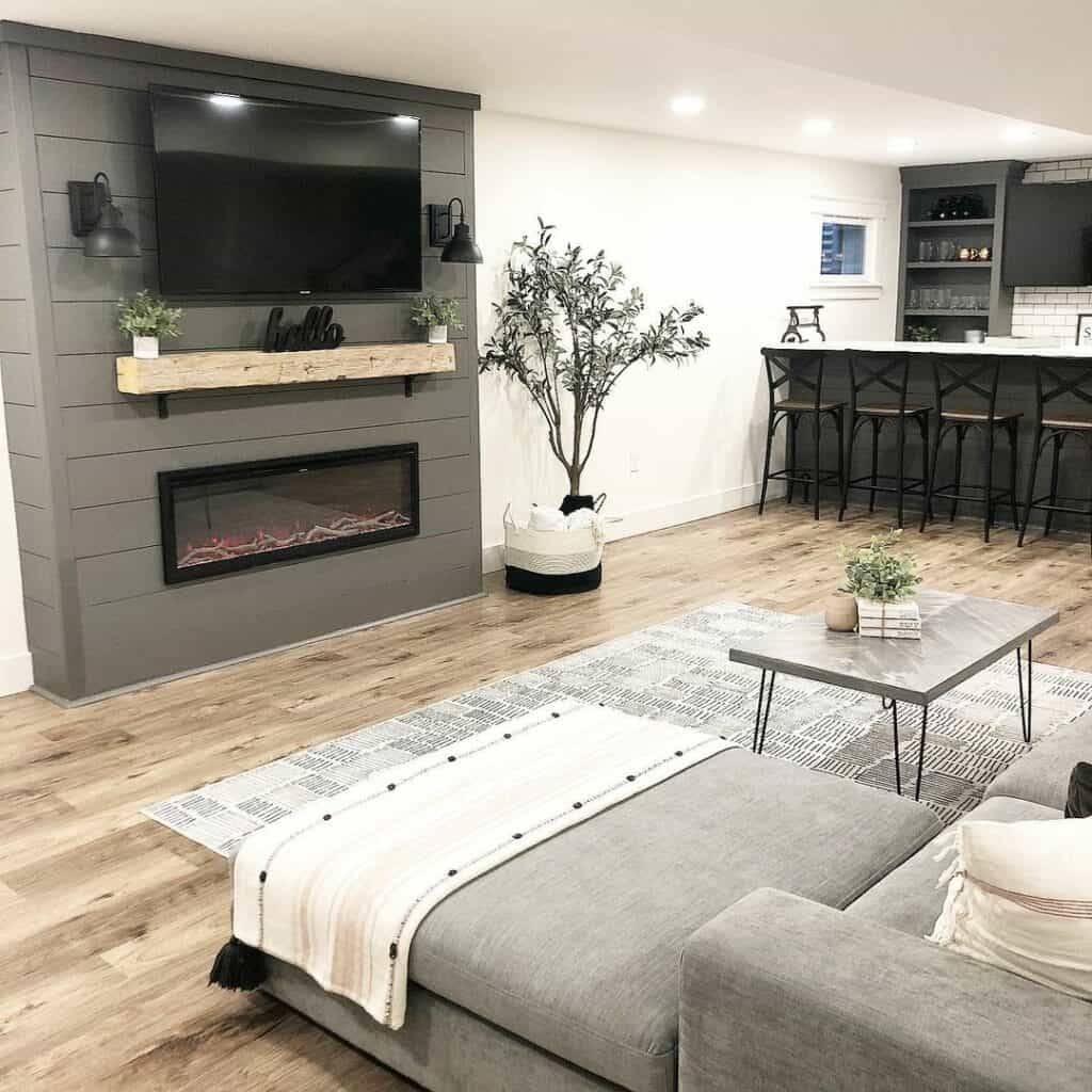 Black Linear Fireplace With a TV