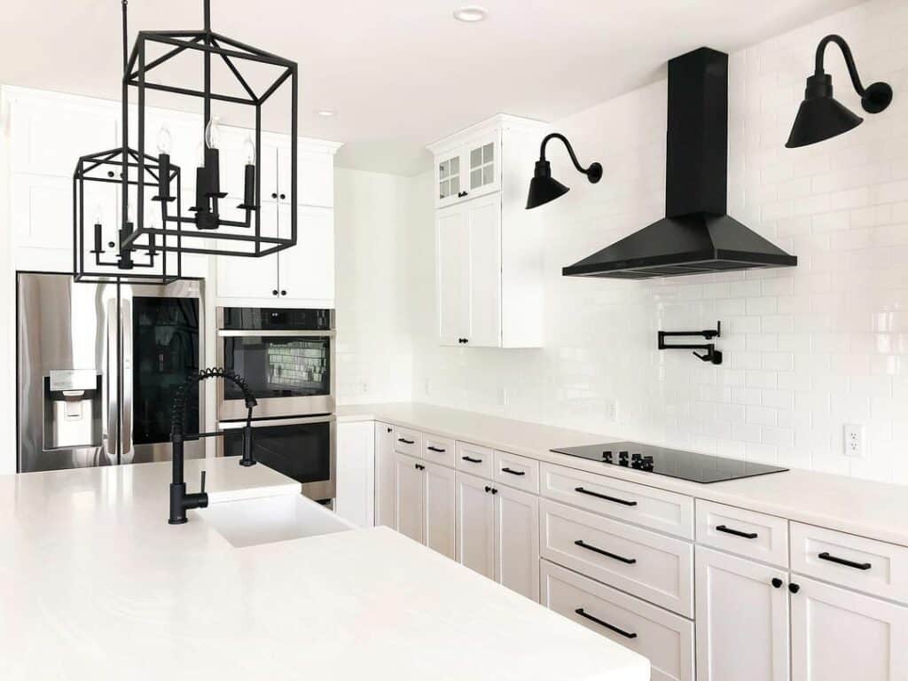 Black Metal Range Hood Between Black Sconces