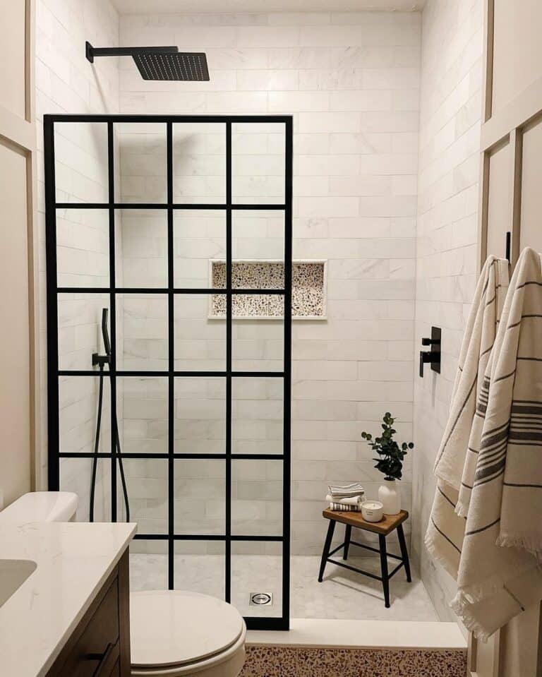Black Shower Head and Subway Tile Walls