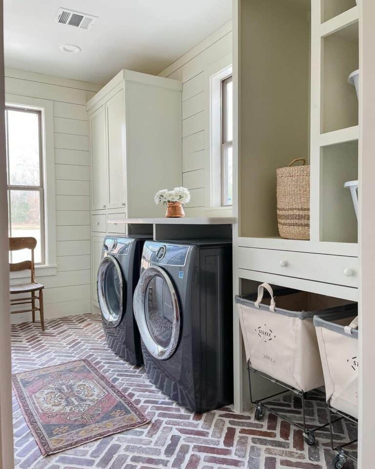 Black and White Laundry Room with Shiplap Paneling and Brick Floor