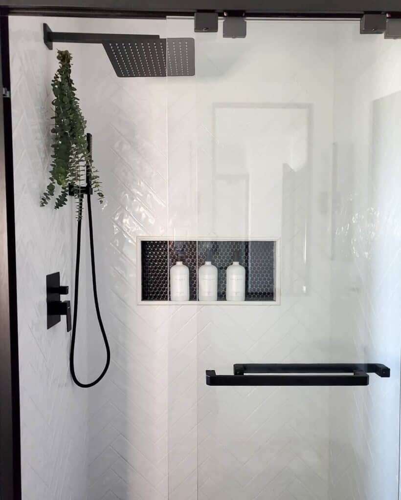 Black and White Shower with Frameless Glass Doors