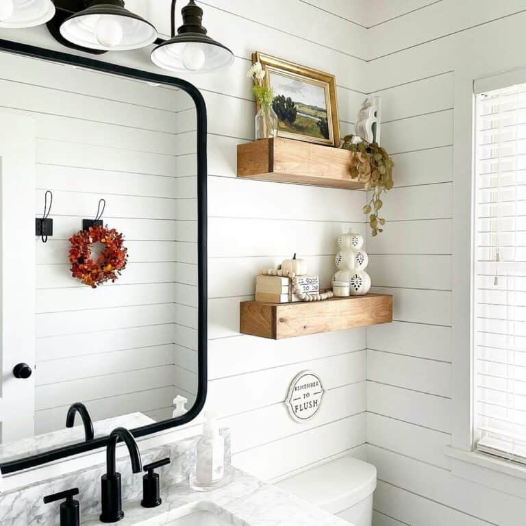 Black and Whtie Farmhouse With Wood Floating Shelves