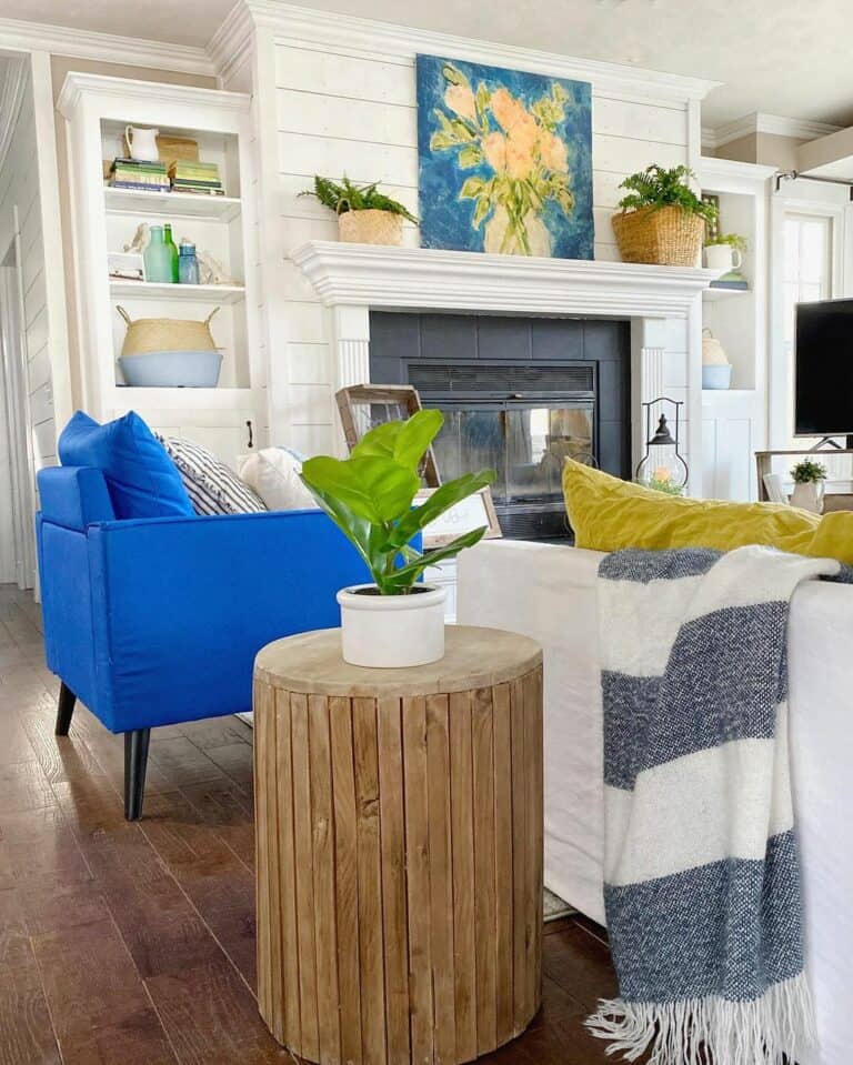 Blue Living Room with a White Shiplap Fireplace Wall
