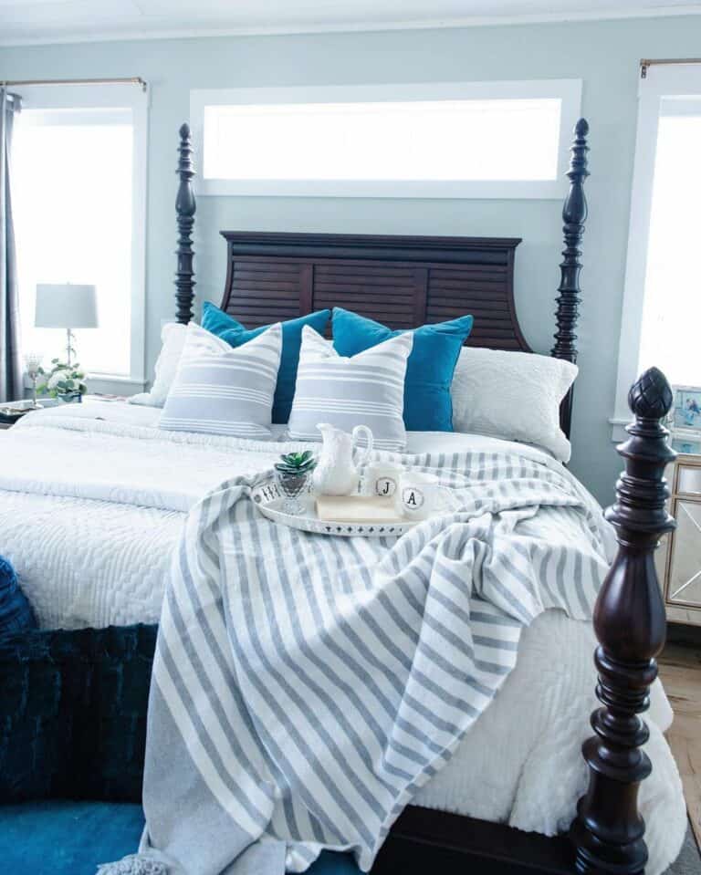 Blue and White Modern Bed in Front of Window