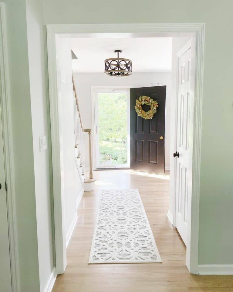 Bright Entryway With Foyer Chandelier