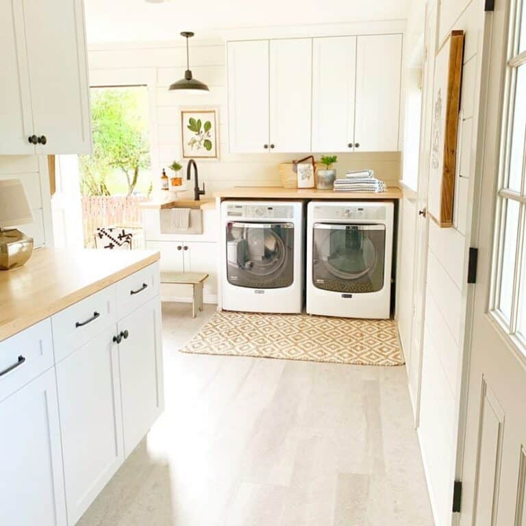 Bright Farmhouse Laundry Room With White Cabinets
