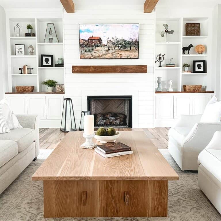 Bright Farmhouse Living Room Featuring TV Over Fireplace