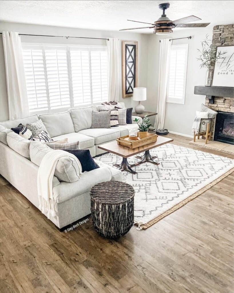 Bright Living Room With Stacked Stone Fireplace