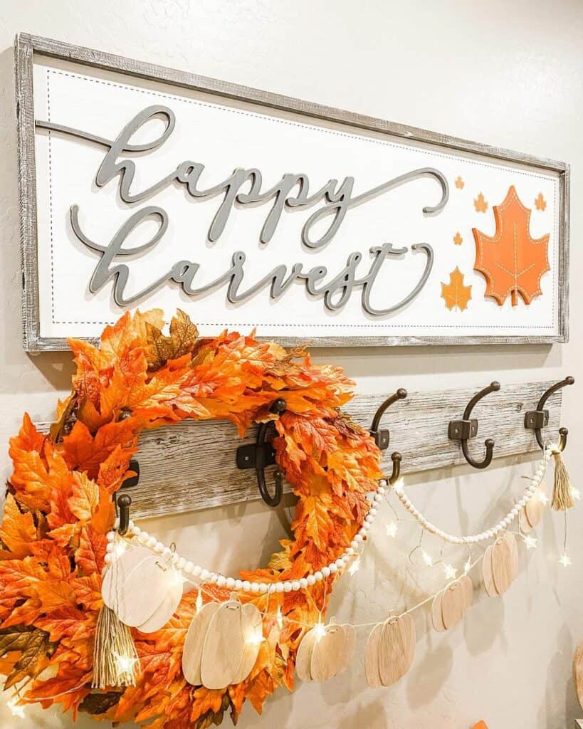 Bright Orange Wreath on Entryway Hooks