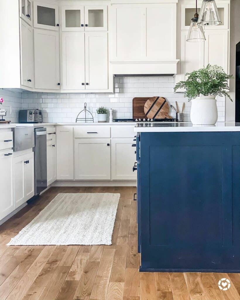 Classic White Kitchen With a Navy Blue Island