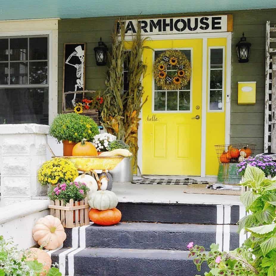 Colorful Farmhouse Entryway With Painted Cement Front Steps