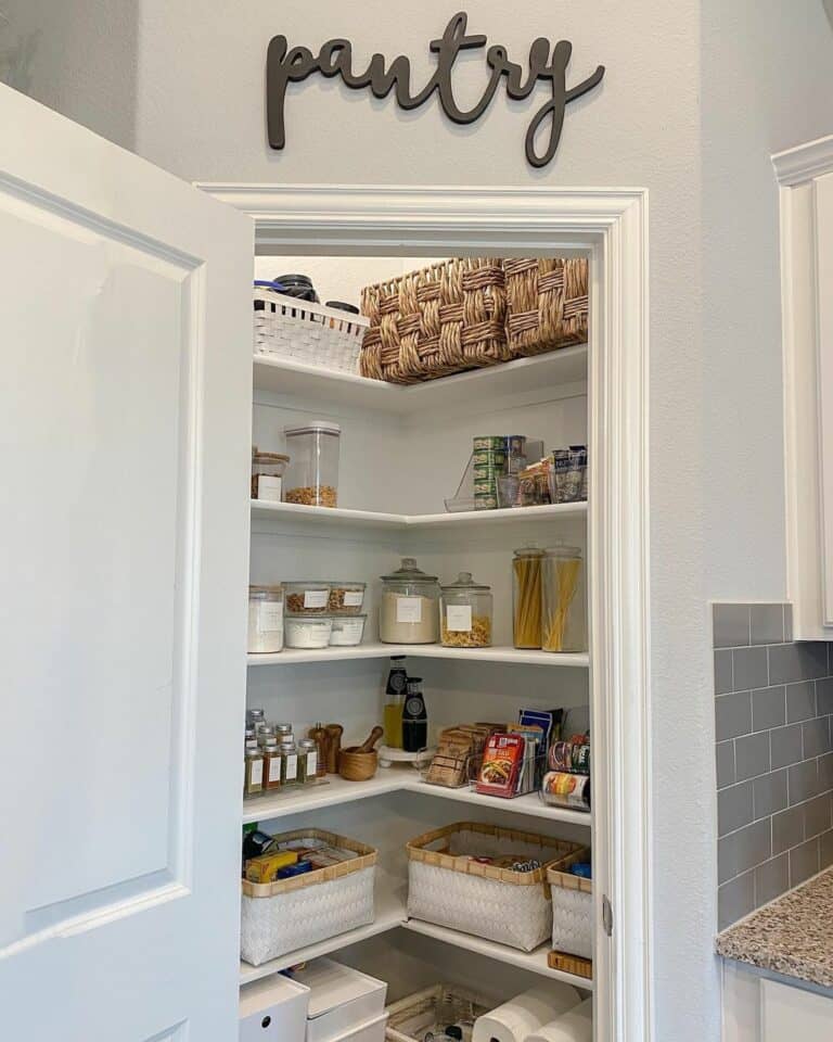 Compact Pantry With Paneled White Door