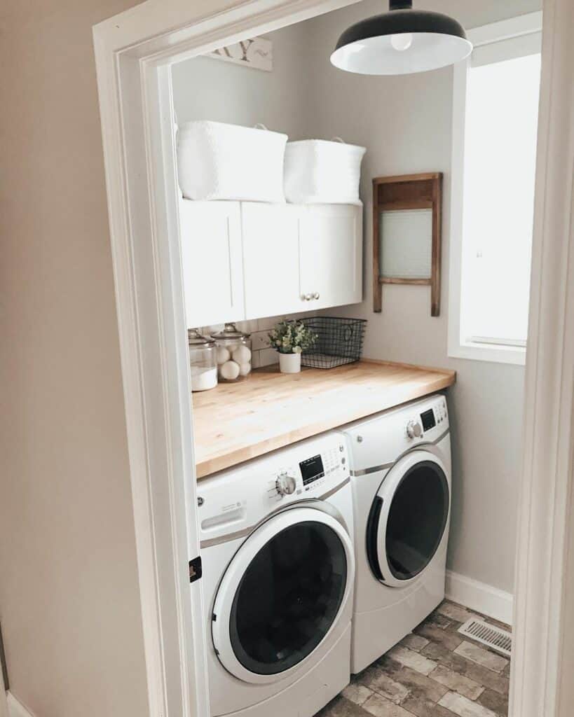 Compact and Functional Laundry Room with Upper Cabinets