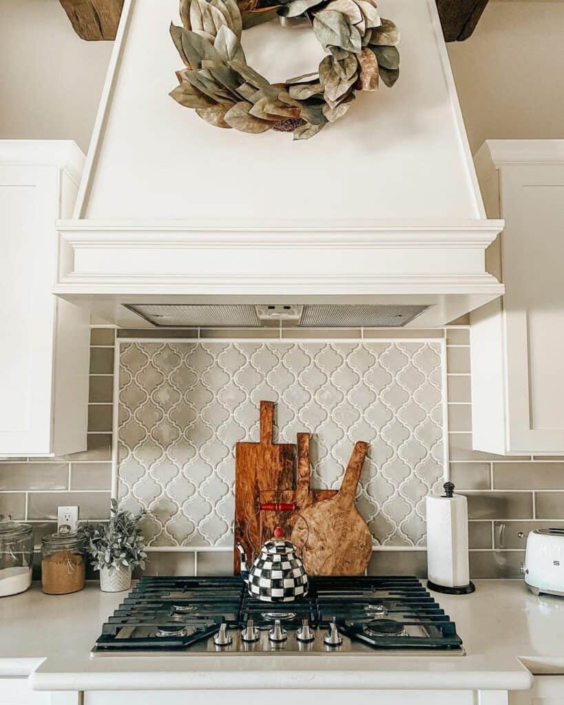 Cooktop Stove with Varying Gray Backsplash