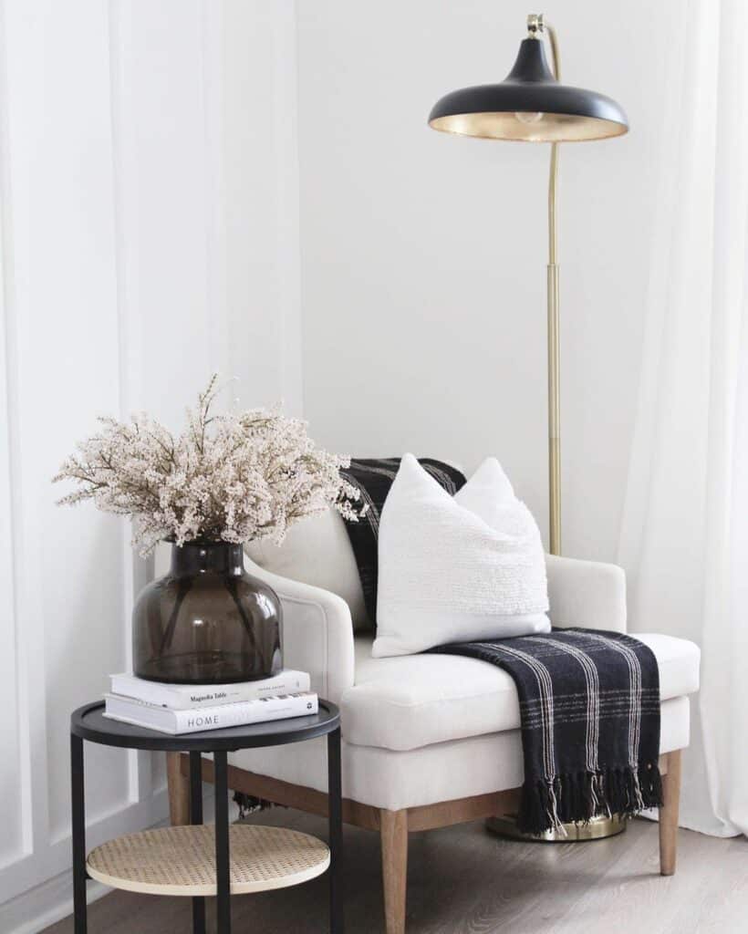 Corner Chair with Black and Gold Lamp