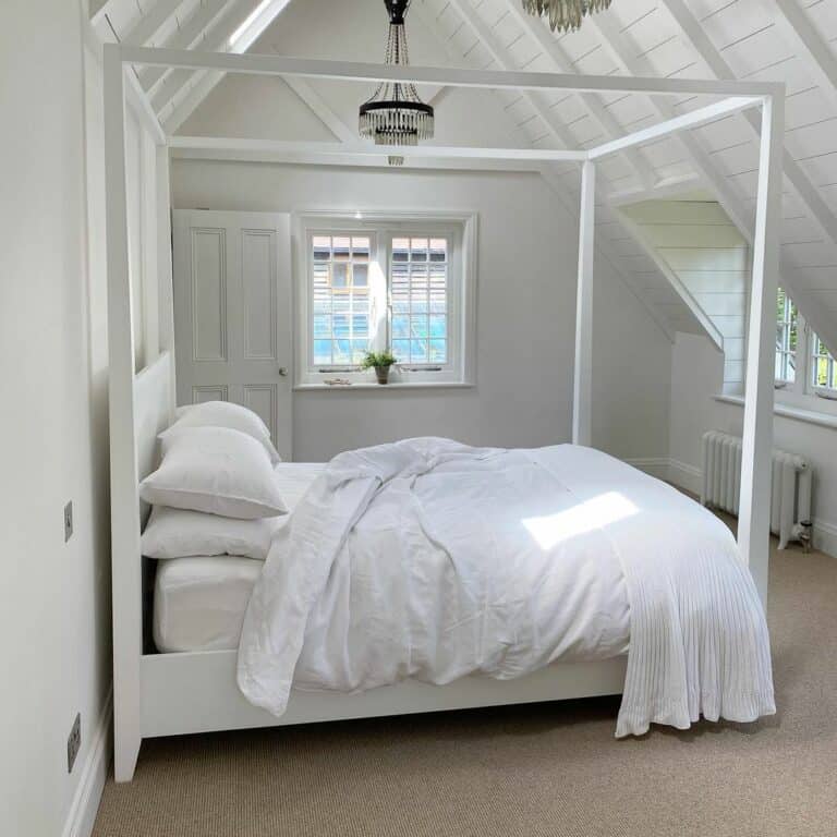 Cozy All-white Bedroom With Cathedral Ceiling