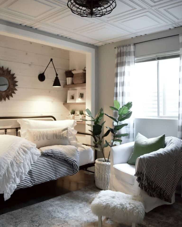Cozy Guest Bedroom With Tasseled Cushions