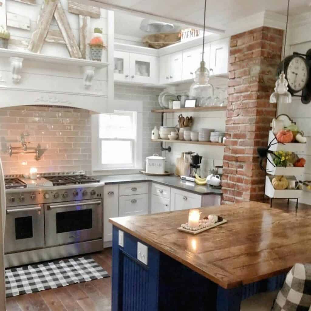 Cozy White Cottage Kitchen With a Blue Island