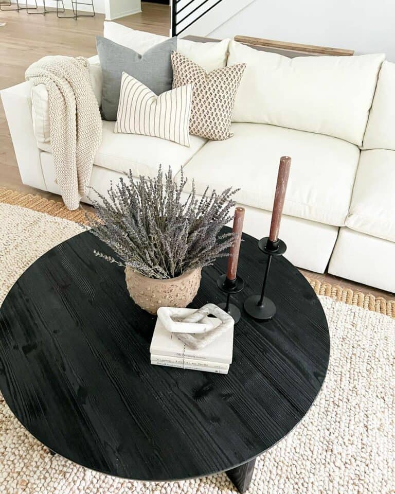 Cream Couch and Black Circular Table