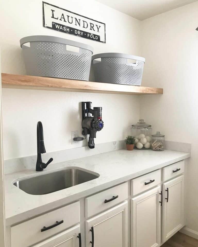 Cream Laundry Room Cabinets and Exposed Wooden Shelf