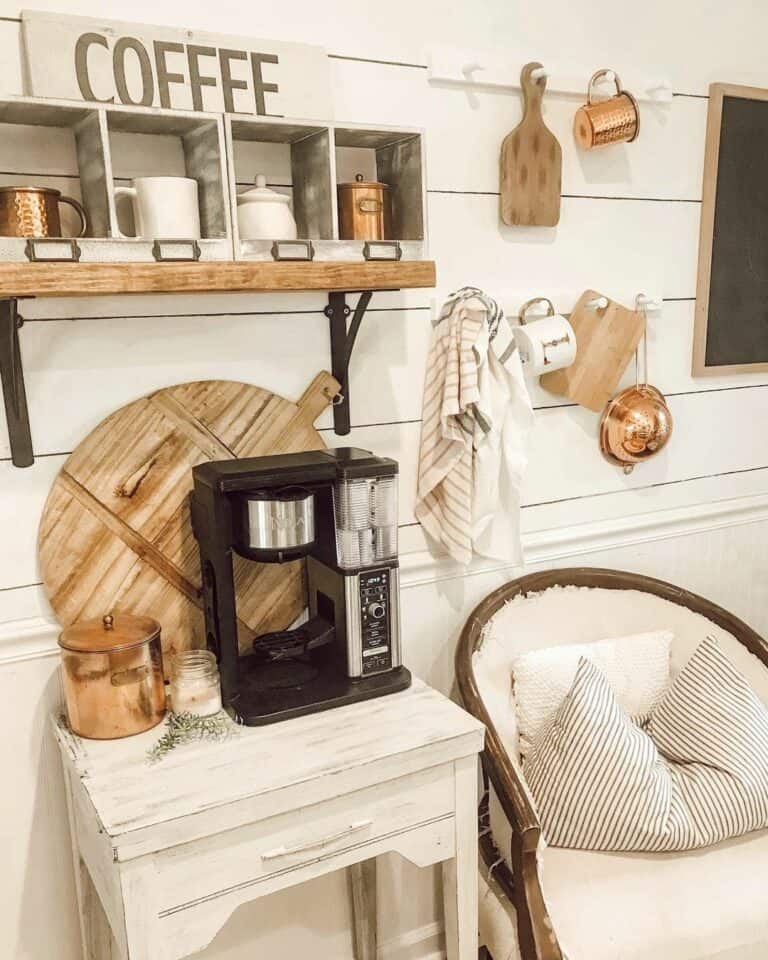 Stylish Coffee Bar with Chalkboard, Black Cabinets, and Floating