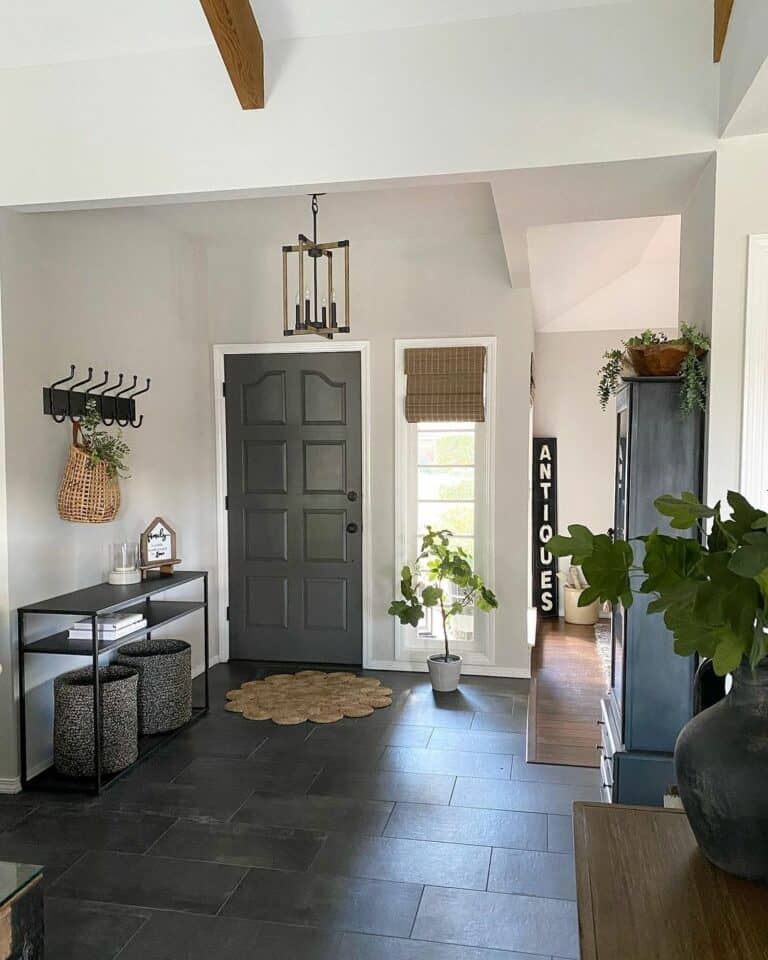 Dark Tile Foyer Hosts Console Table