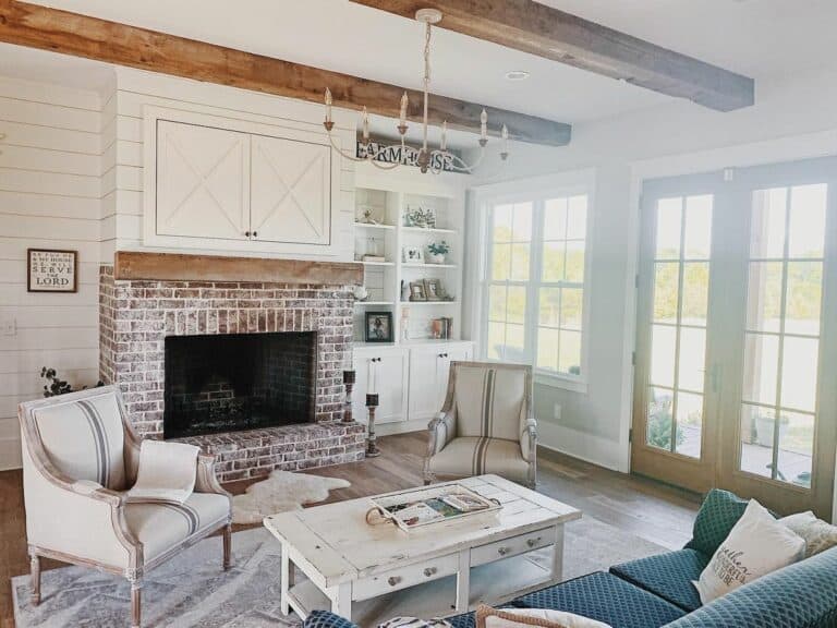 Decorative Ceiling Beams Over a Red Brick Fireplace