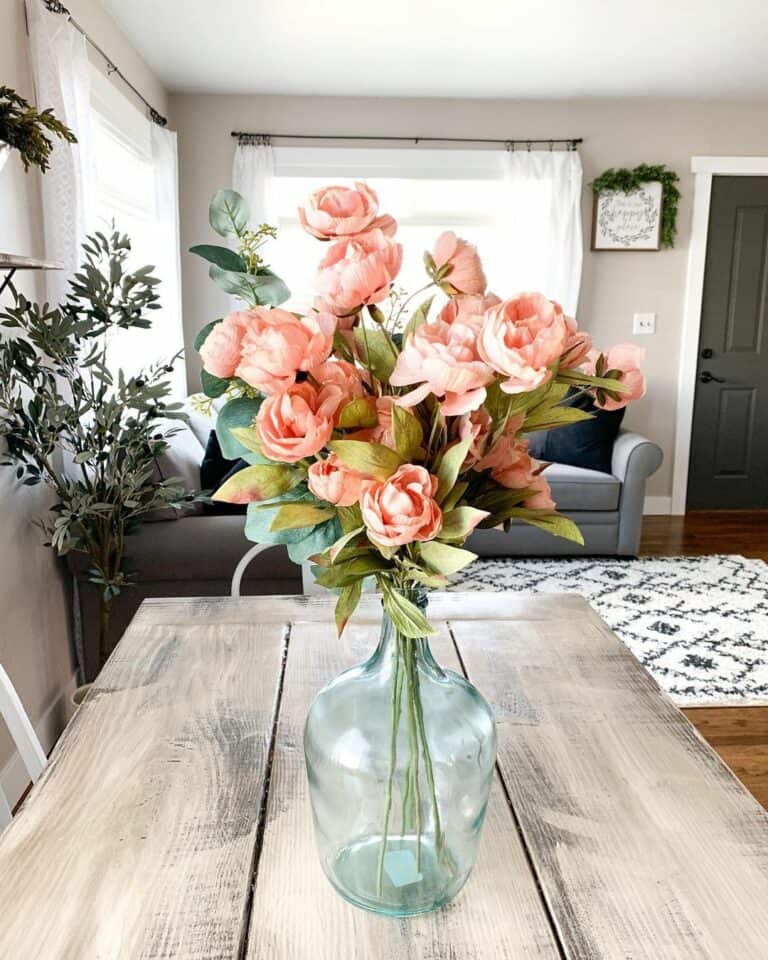 Elegant Pink Peonies on a Wooden Dining Table