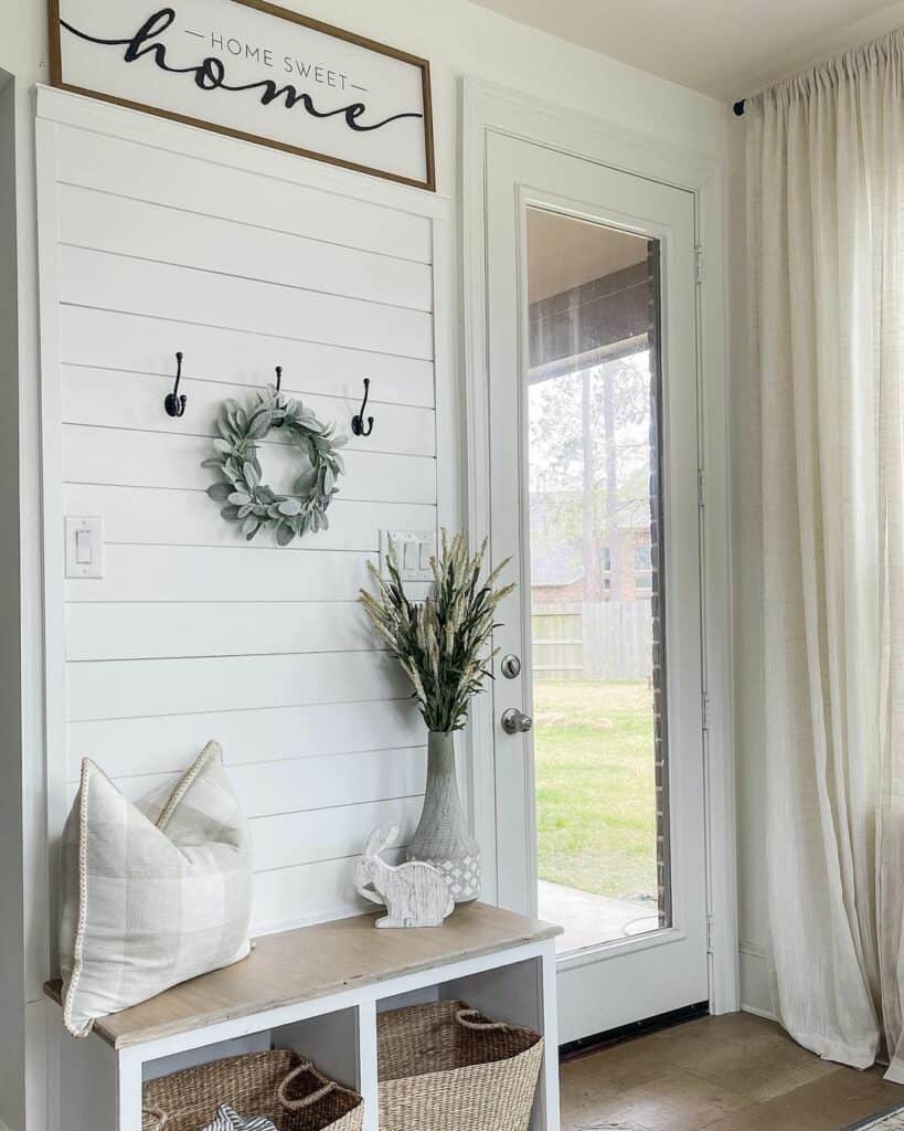 Entry Door With Shiplap Walls and Welcome Bench