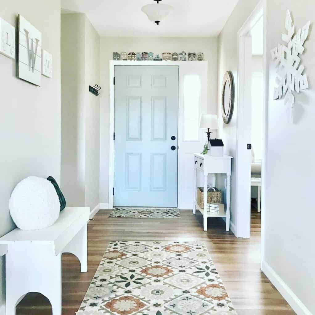 Entryway With Light Blue Front Door