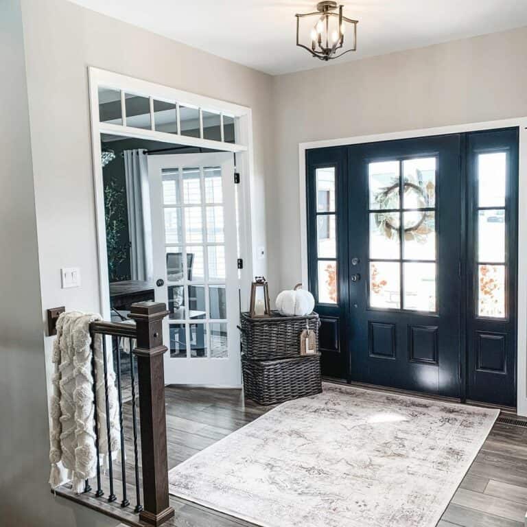 Entryway with a Black Front Door With Sidelights