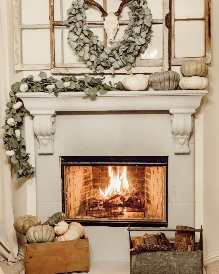Fall-Themed Fireplace With Pumpkin Decorations