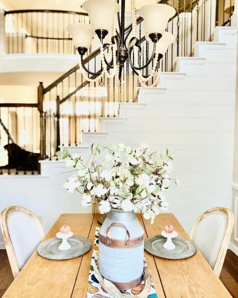 Farmhouse Dining Room Scene with Rustic Centerpiece