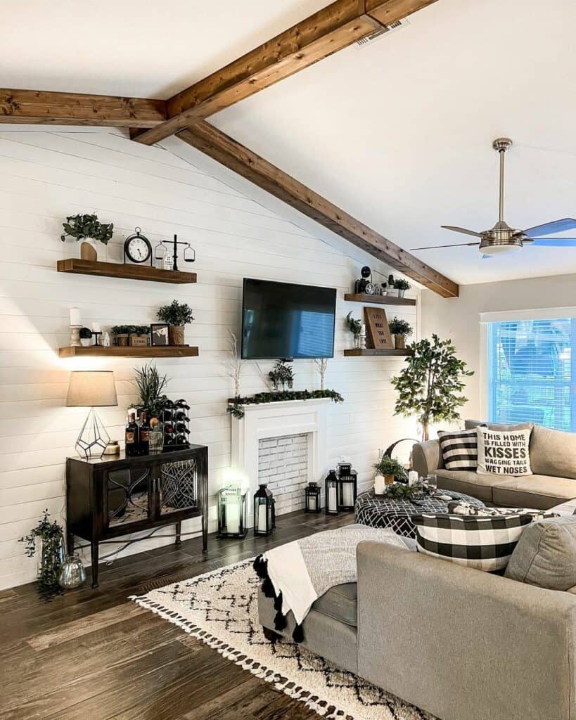 Farmhouse Living Room With Beams and Shiplap Paneling