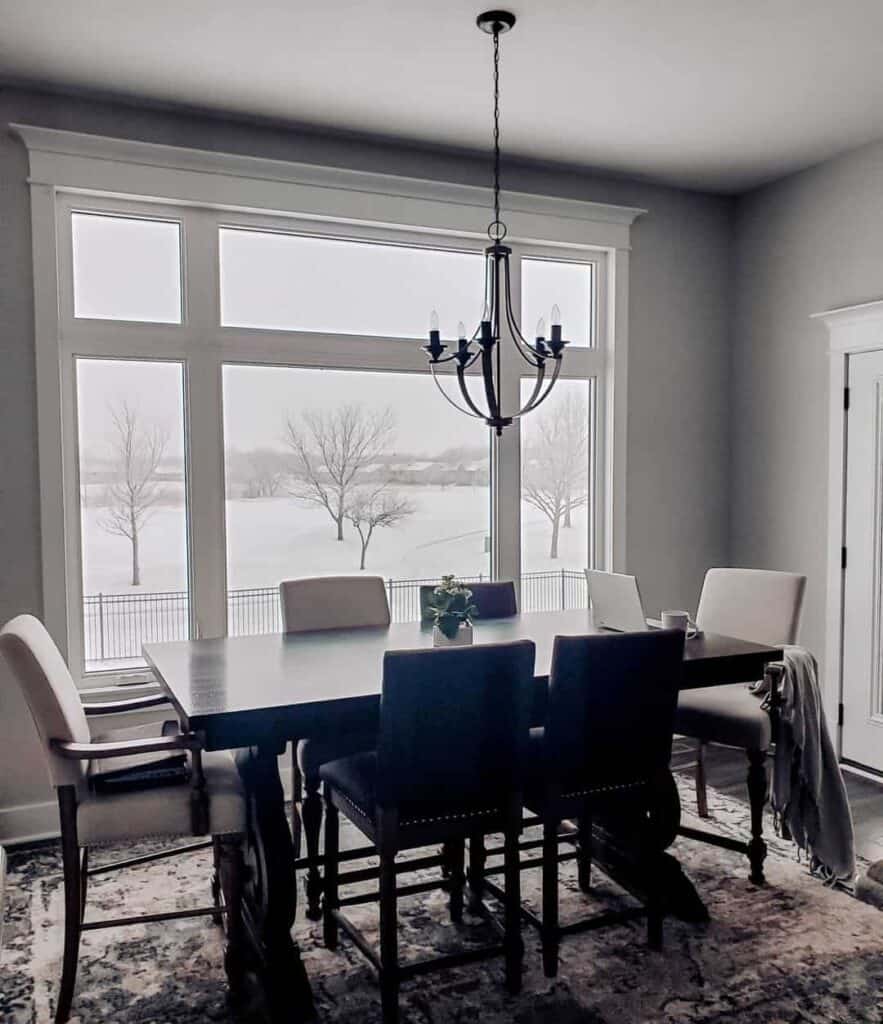 Farmhouse-Style Dining Room With White Window Trim
