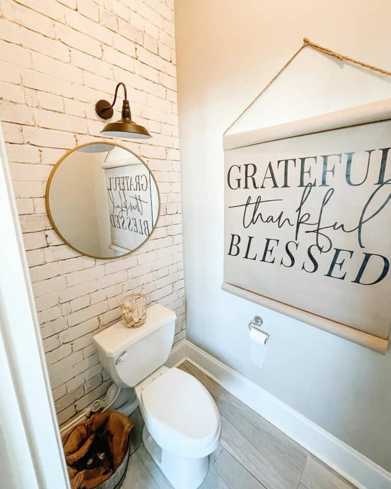 Faux Brick Wallpaper With Brass Sconce