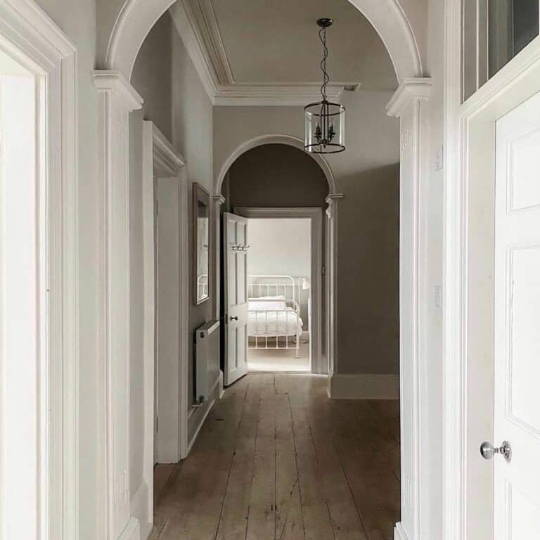 Glass Hallway Chandelier Over a Warm Wood Floor