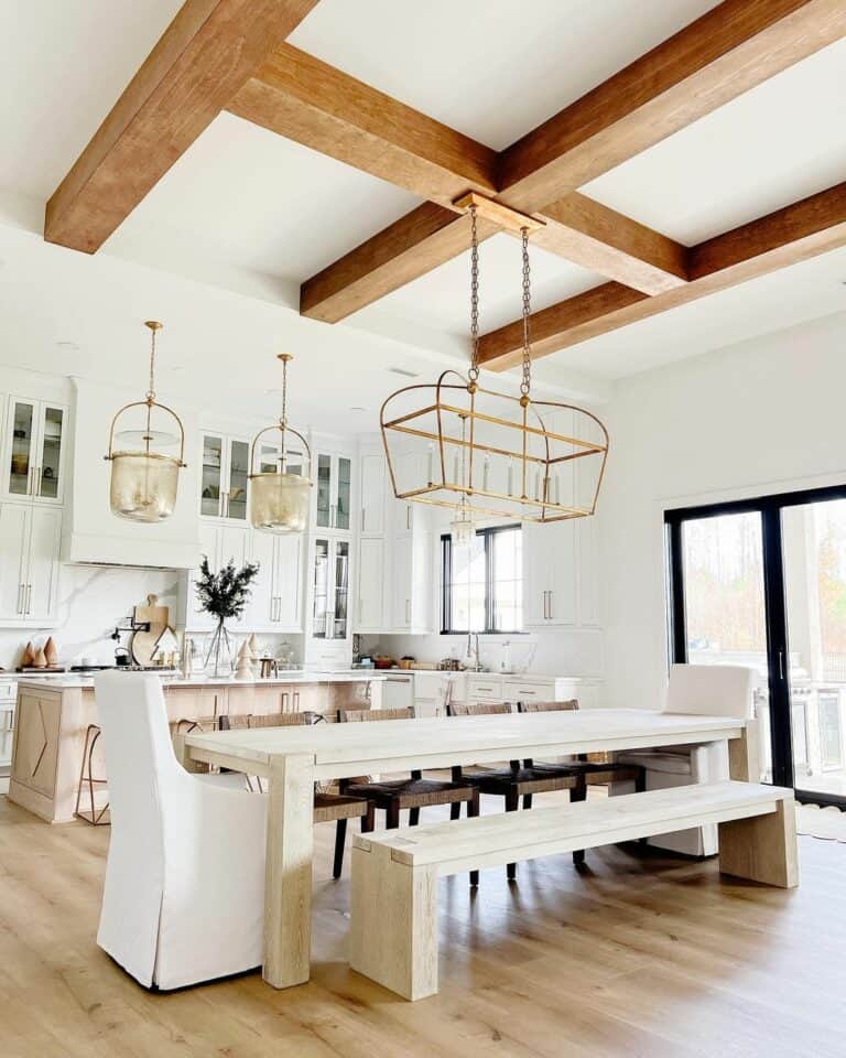 Gold Chandelier and Warm Wood Ceiling Beams