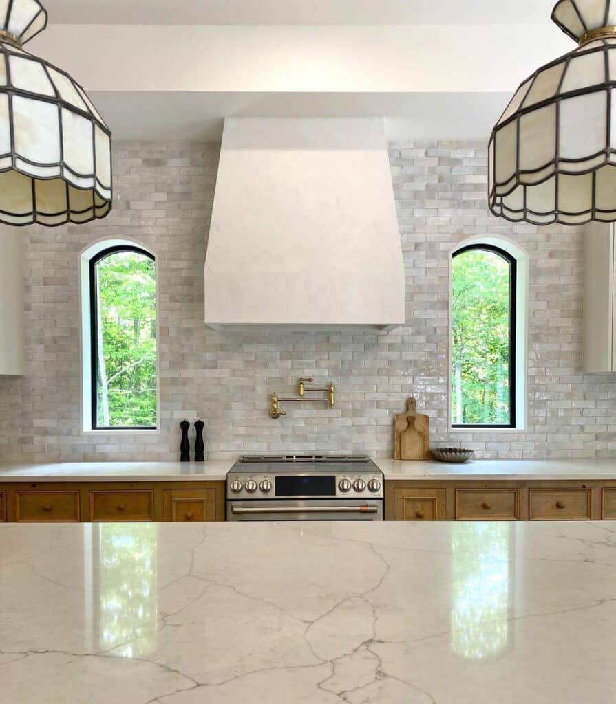 Gray Backsplash Surrounds Arched Windows