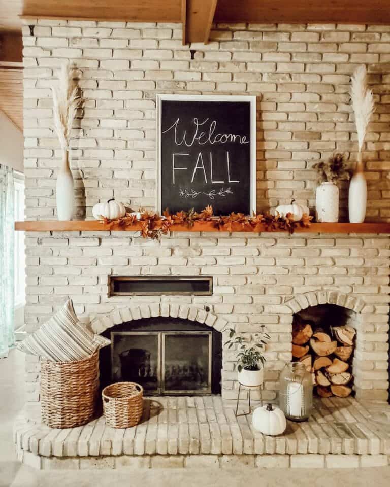 Gray Brick Fireplace with White Frame Chalkboard