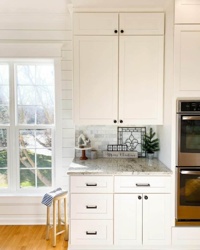 Gray Marble Countertop With White Cabinets