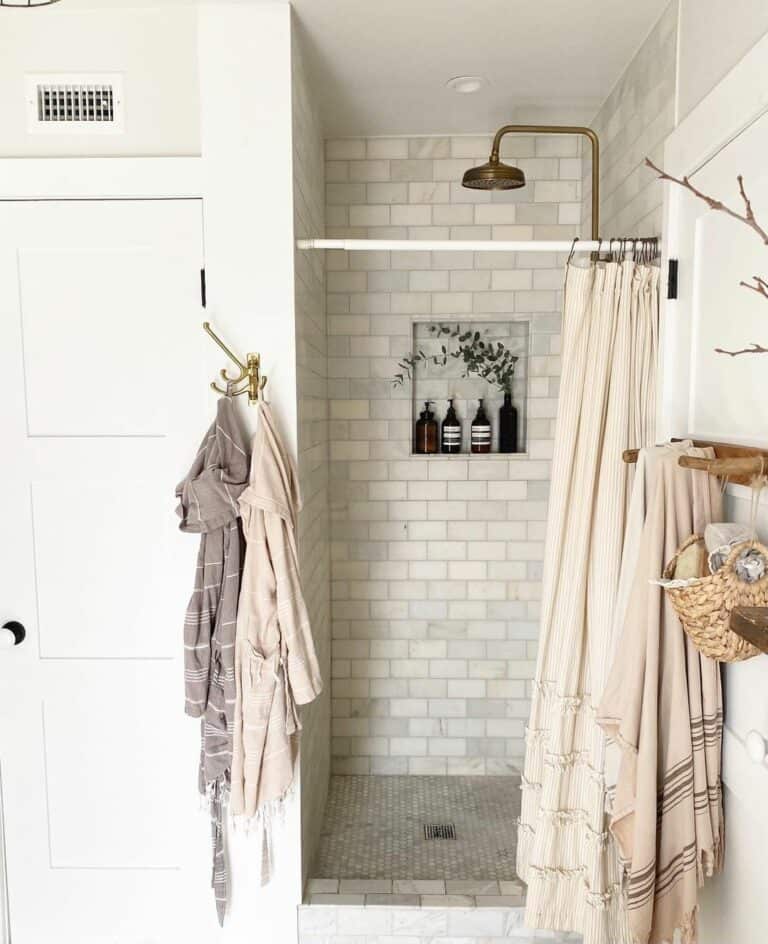 Gray Tiled Shower with Neutral Shower Curtain