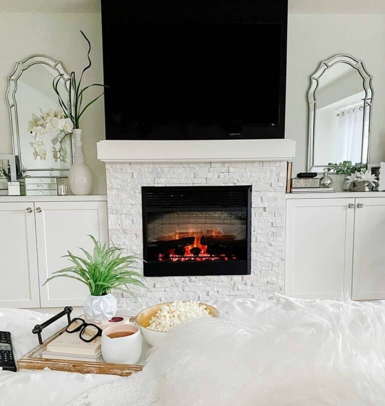 Impressive Modern Bedroom TV Over White FIreplace