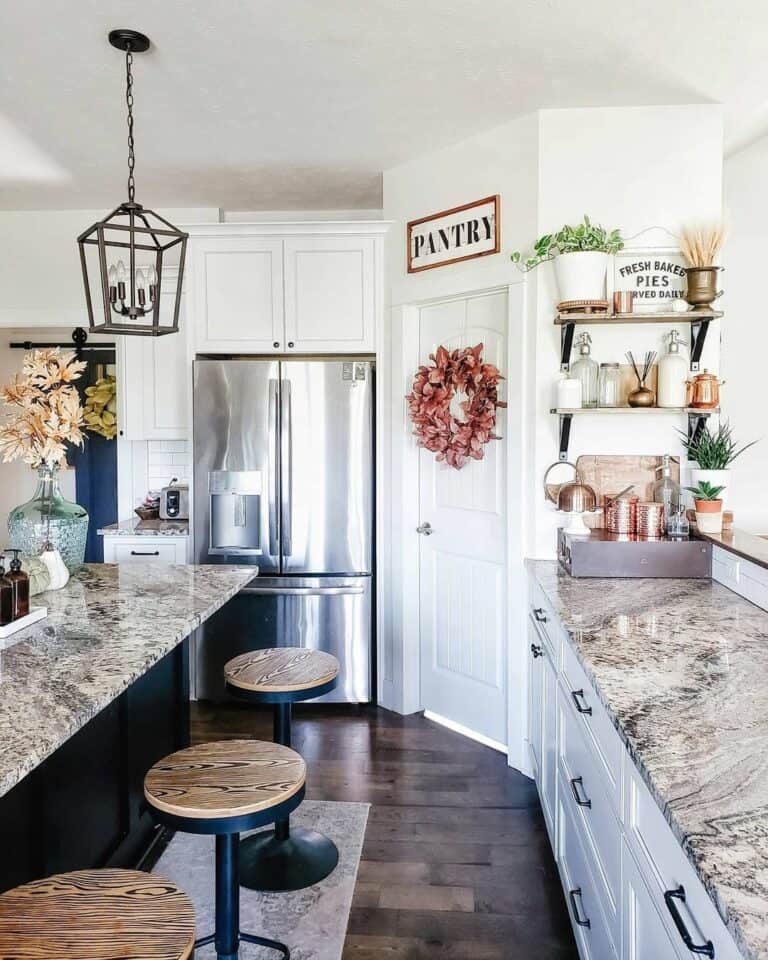 Kitchen With Corner Pantry Among White Cabinets