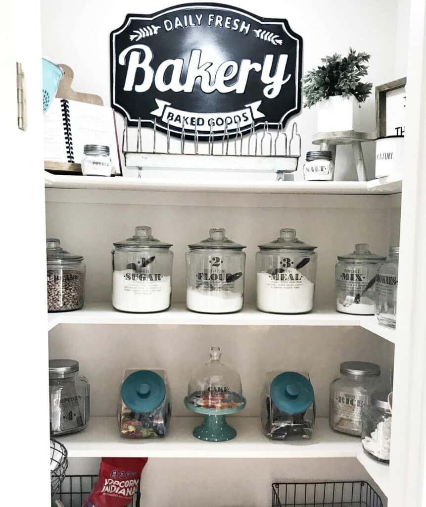 Labeled Glass Canisters on Pantry Shelves