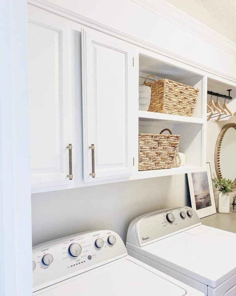 Laundry Room With White Cabinets and Exposed Shelves