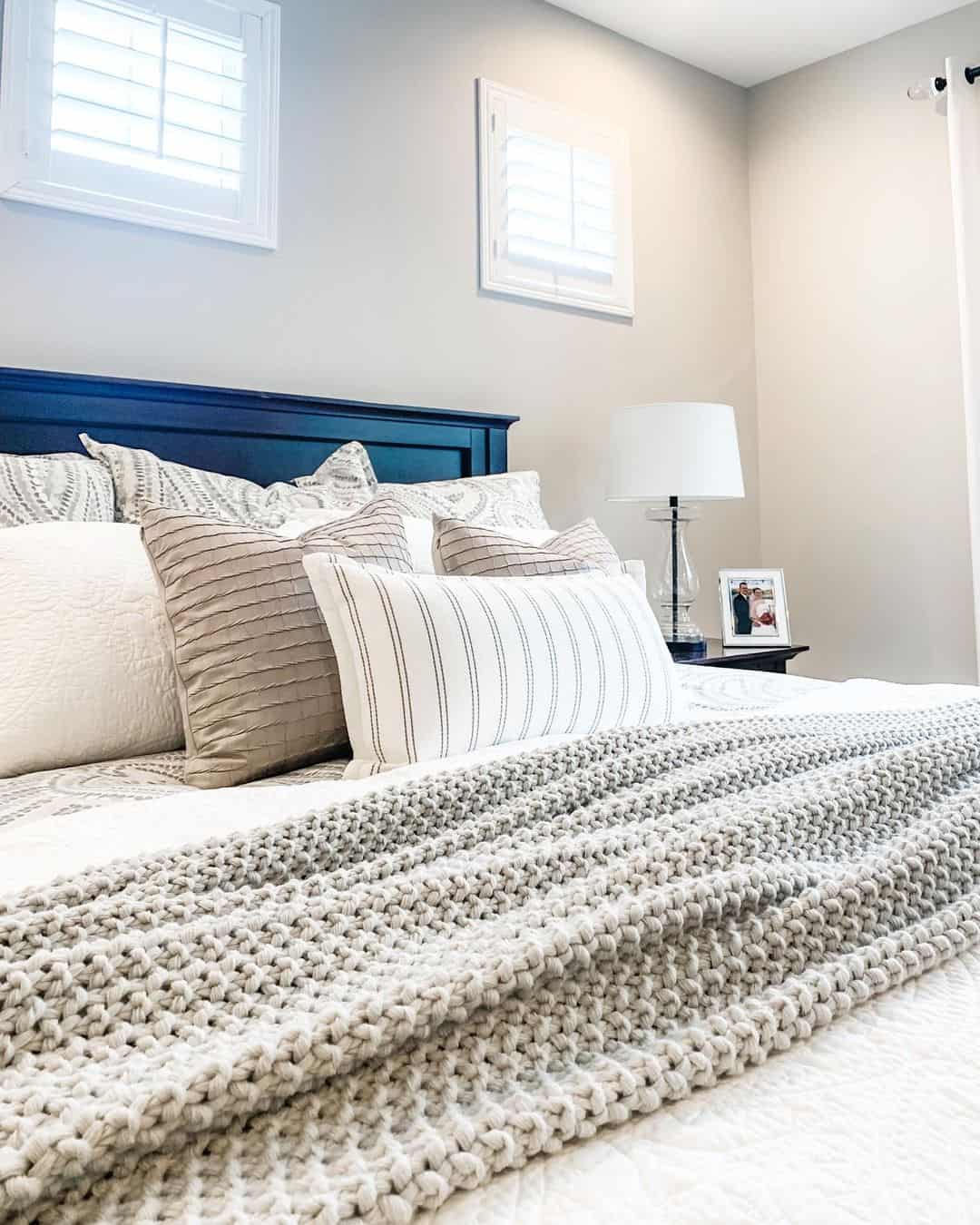 Light Grey Blanket Draped Over a White Coverlet Soul & Lane