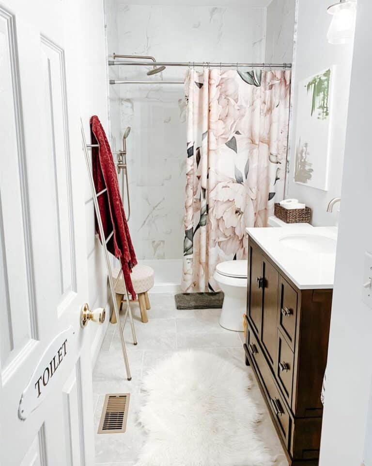 Marbled White Tile and a Flowered Shower Curtain