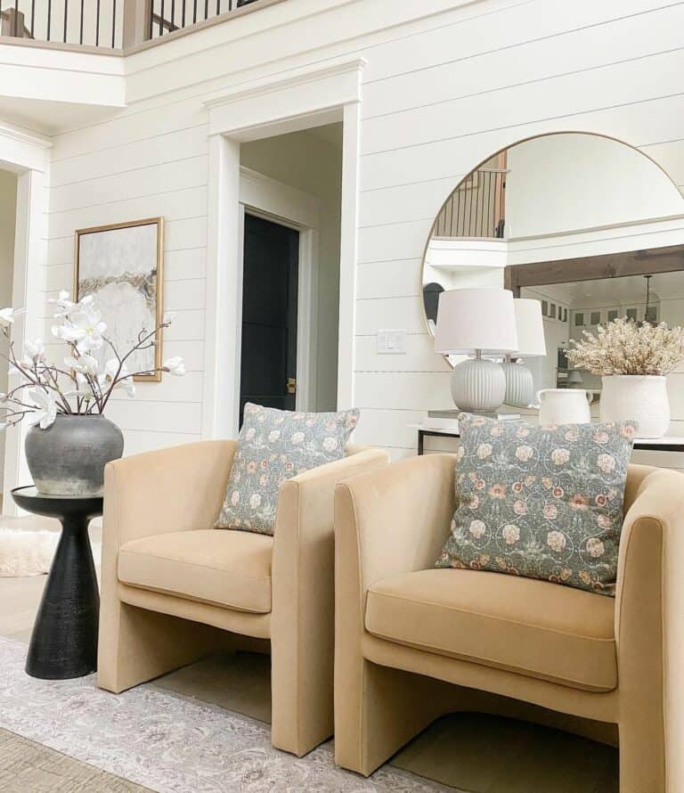 Matching Accent Chairs Adorned With Floral Accent Pillows